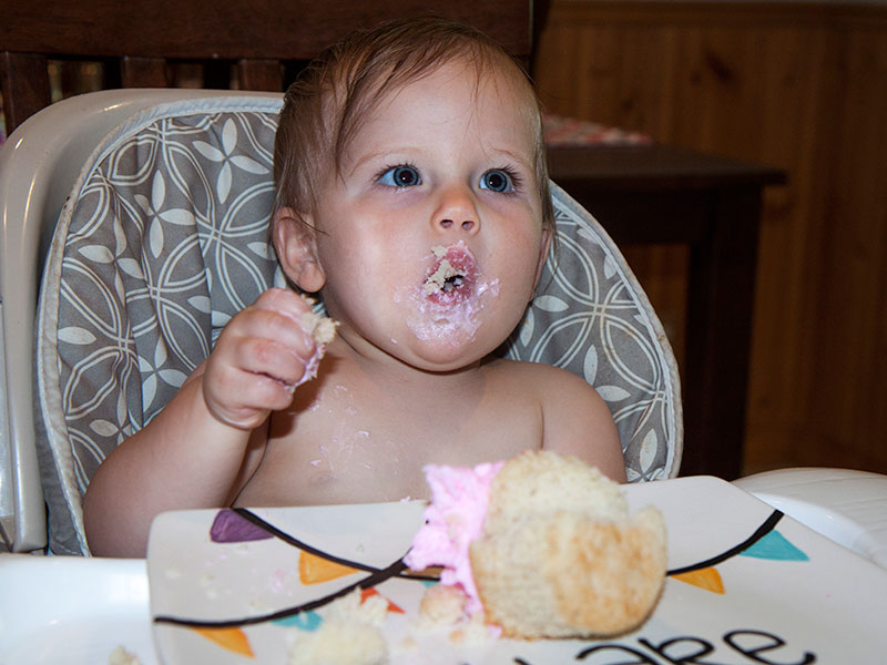 Her first taste of cake earlier in the week on her actual birthday